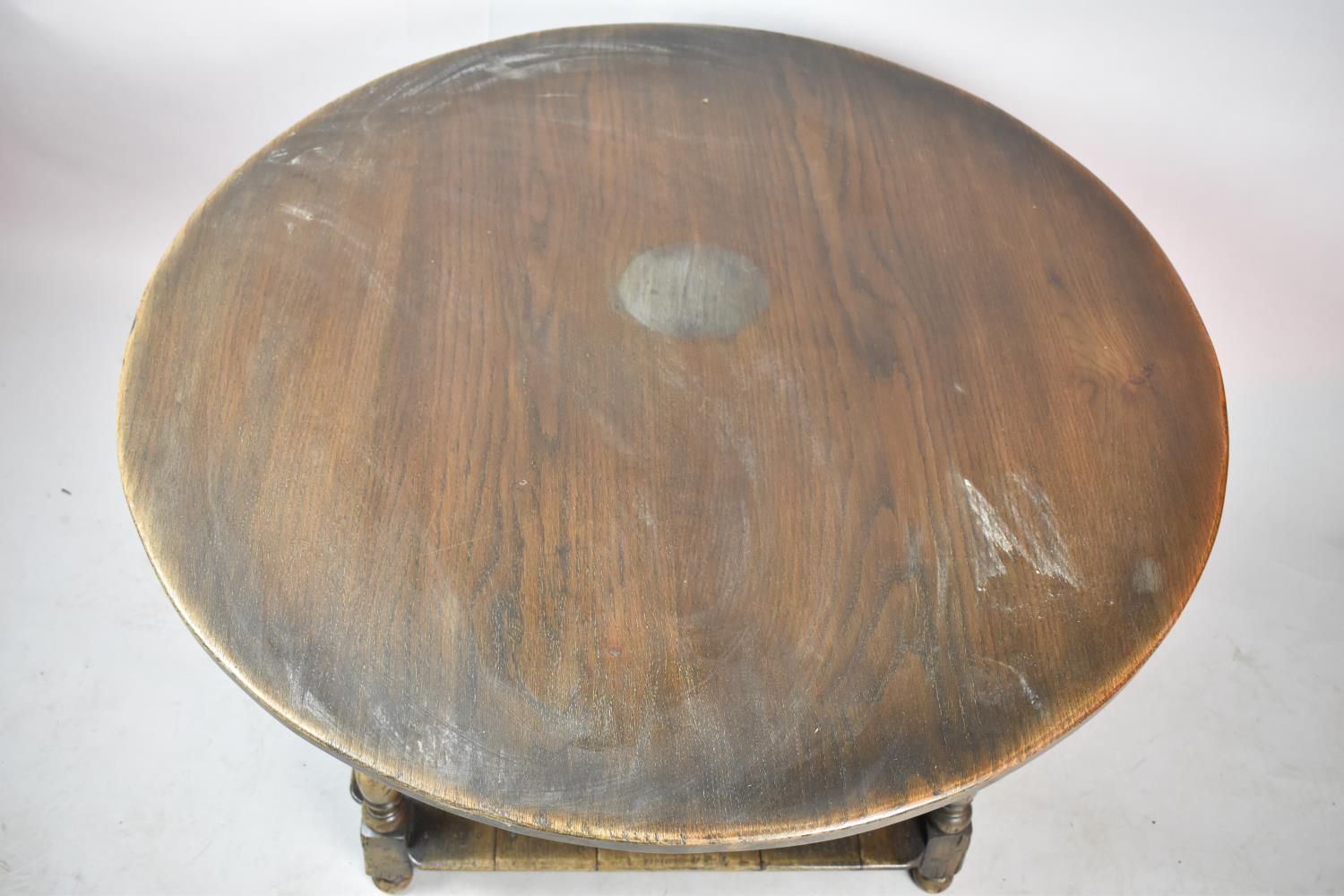 A Mid 20th Century Circular Topped Oak Centre Coffee Table with Square Stretcher Shelf, Water Damage - Image 2 of 2