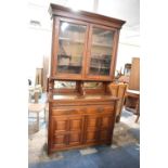 An Edwardian Walnut Library Bookcase with Two Drawers Over Cupboard Base, Centre Mirrored Panels and