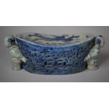 An Oriental Glazed Blue and White Ceramic Opium Pillow with Pierced Body Flaked Carrying by