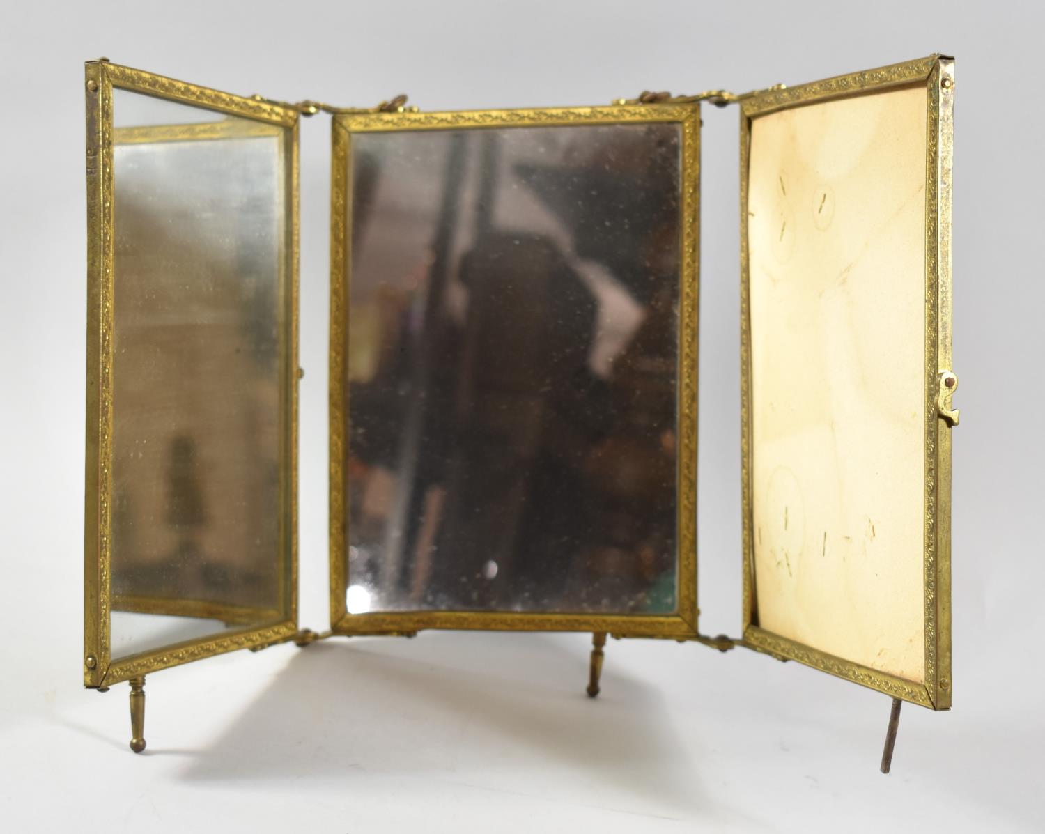 A Gilt Metal Framed and Hinged Triple Travelling Dressing Mirror, In Need of Some Attention and