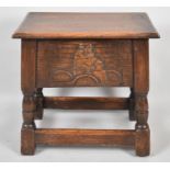 A Mid 20th Century Oak Lift Top Sewing Box with Carved Front and Back Panels, 46cm Wide