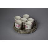 A Circular Galleried Silver Plated Tray Containing Six Enoch Wedgwood Coffee Cans with Floral