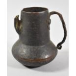 A Hand Beaten Copper Jug with Twisted Handle, Spout AF, 10cm high
