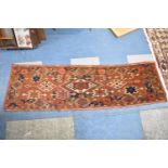 A Small Patterned Woollen Runner, 153x45.5cm