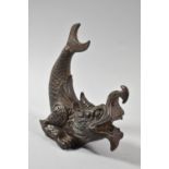 An Oriental Cast Iron Study of a Fish Tailed Dragon, 18cm high