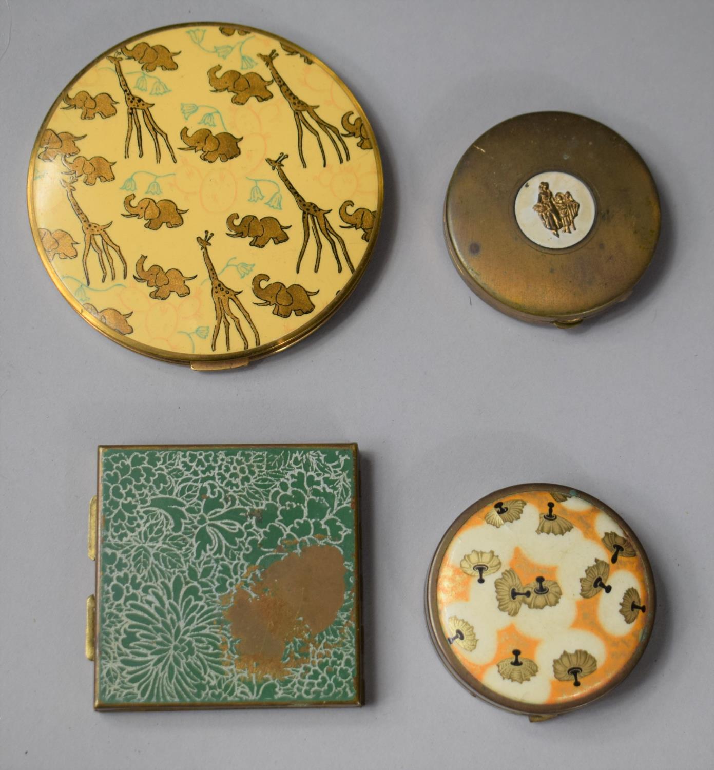 A Collection of Four Vintage Powder Compacts to Include Vogue Example Decorated with Elephants and