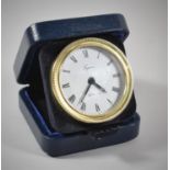 A Cased Silver Tregawne Circular Travelling Alarm Clock, Hallmark for London 1986, Working Order