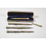 A Gold Plated Wahl Eversharp Propelling Pencil and Three Others Together with Tube of Baxters