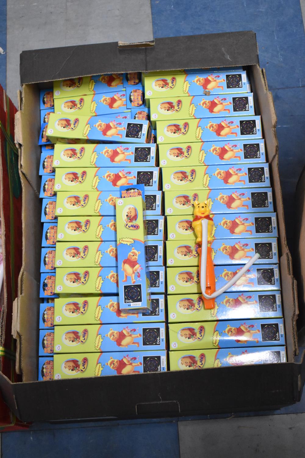 A Box Containing Large Quantity of Winnie the Pooh Whistles