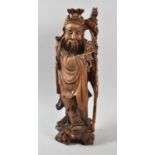 A Chinese Carved Wooden Study of Immortal with Staff Carrying Posy of Flowers, Some Attention Flaws,