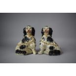 A Pair of Reproduction Staffordshire Spaniels, 19cm high