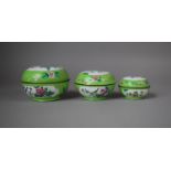 A Collection of Three Graduated Chinese Cloisonné Lidded Pots of Squat Globular Form on Green Ground