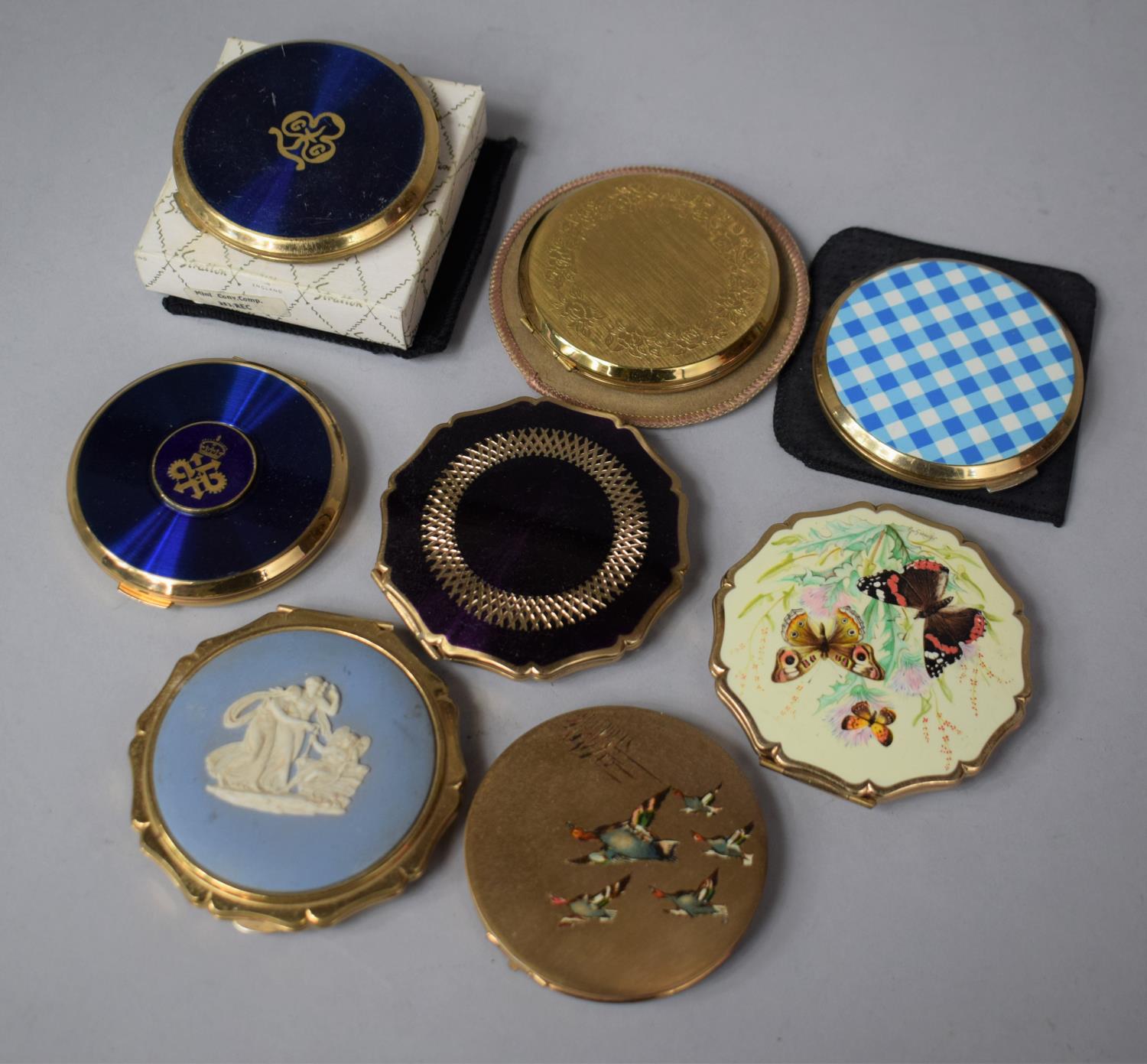 A Collection of Various Stratton Powder Compacts