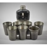 A Small Hip Flask Together with Six Pewter Measures