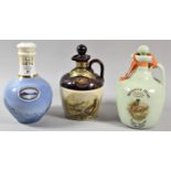 A Collection of Three Ceramic Decanters Containing Isle of Skye and Rutherford's Whisky and Irish