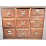 An Edwardian Ten Drawer Shop Cabinet with Brass Fittings, 115cm wide