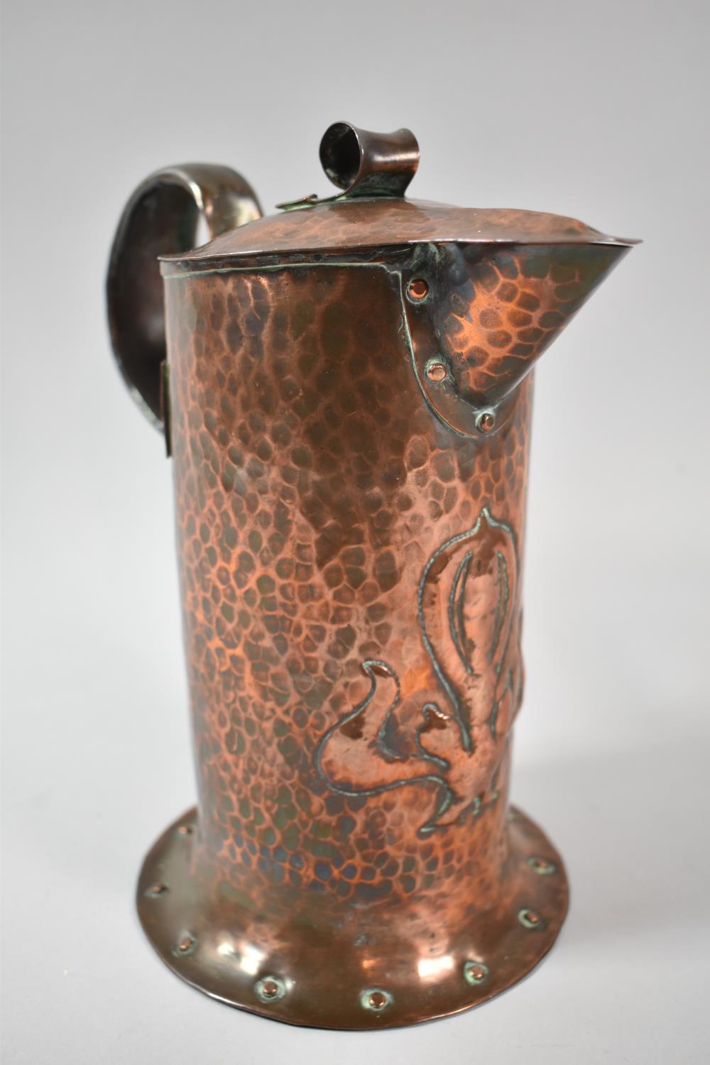 An Arts and Crafts Copper Jug by William Soutter & Sons, 22cm high