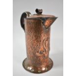An Arts and Crafts Copper Jug by William Soutter & Sons, 22cm high