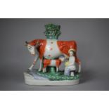 A Reproduction Staffordshire Spill Vase, Cow with Calf and Milk Maid, 24cm high