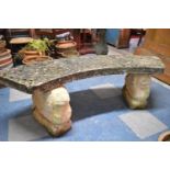 A Reconstituted Stone Crescent Shaped Garden Bench on Lion Supports, 144cm Long