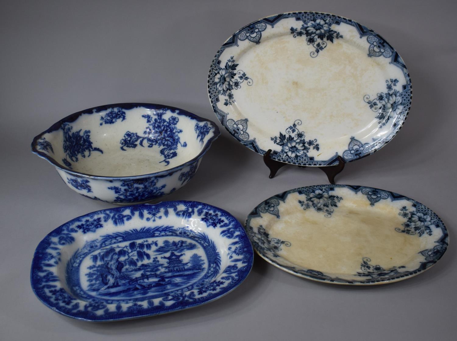 A Large Flow Blue Washbowl Together with Three Platters
