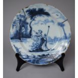 An 18th Century Delft Blue and White Circular Plate Decorated with Figures in an Italianate