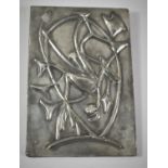 A Small Hammered Pewter Wall Hanging Plaque Decorated in Relief with Flowers, 20.5cm high, Early