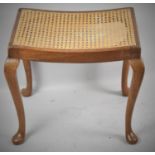 A Mid 20th Century Walnut Framed Cane Upholstered Dressing Table Stool on Cabriole Legs, 52cm wide