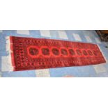 A Handmade Afghan Runner on Red Ground, 305x84cm