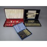 A Cased Set of Six Bone Handled Butter Knives and Two Cased Sets of Fish Knives and Forks