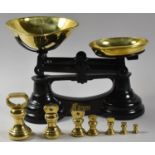 A Set of Black Cast Iron Kitchen Scales by Librasco with Brass Pans and Set of Graduated Bell