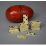 A Collection of 28 Miniature Bone Dominoes, Possibly Prisoner of War, Housed in Ovoid Container