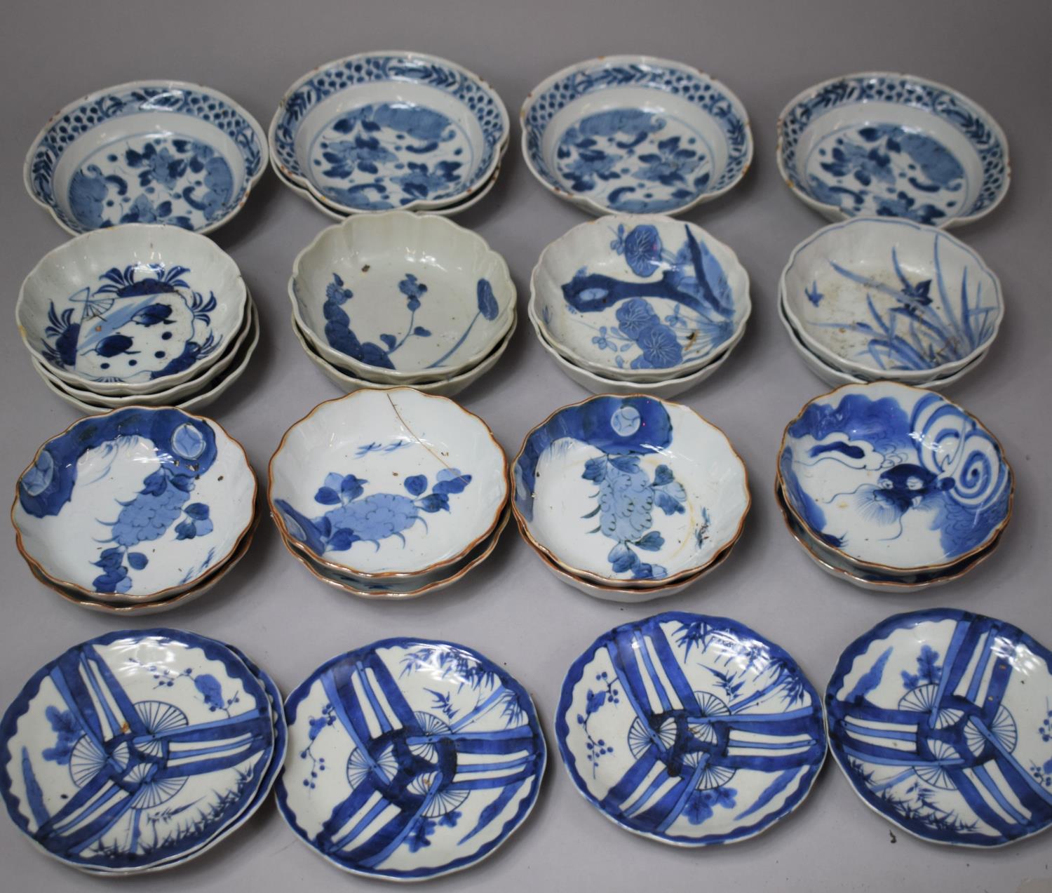 A Collection of 27 Pieces Oriental Blue and White China to Include Shallow and Shaped Bowls,