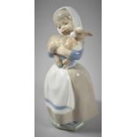 A Spanish Nao Figure of Girl with Lamb, 21cm high