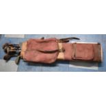 A Vintage Leather and Canvas Golf Bag Containing Metal Shafted Golf Clubs