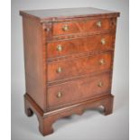 A Reproduction Mahogany Four Drawer Bachelor's Chest with Hinged Top Flap, Bracket Feet, 59cm Wide