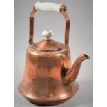 A Copper Kettle with Ceramic Handle and Knob, 27cm high