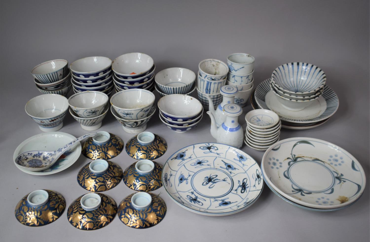 A Large Collection of Blue and White Oriental Dinner wares to Include Bowls, Beakers, Plates, Dishes