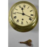 A Circular Brass Cased Ships Bulkhead Clock, Movement Over Wound and In Need of Attention,