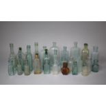 A Collection of Various Green and Blue Glass Bottles