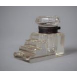 A Small Stepped Glass Desktop Inkwell, 6.75cm Long