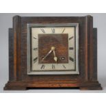 An Art Deco Oak Mantle Clock by Garrard, 28.5cm Wide