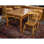 A Mid 20th Century Pine Rectangular Kitchen Table with Single Drawer and Four Spindle Backed Chairs,