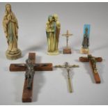 A Collection of Various Religious Figures and Crucifixes