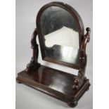 A Late Victorian Mahogany Dressing Table Mirror with Carved Scrolled Supports, Plinth Base and Bun