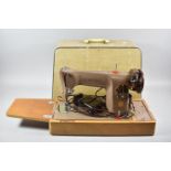 A Cased Vintage Electric Singer Sewing Machine with Foot Controller