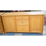 A Modern Dining Room Sideboard with Three Centre Drawers Flanked by Cupboards, 150cm Wide