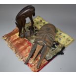 A Carved Wooden African Souvenir Mask and Antelope Figure Together with Three Indian Silks