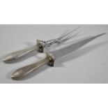 A Pair of Sterling Silver Handled Carving Irons