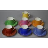 A Paragon Harlequin Set of Six Coffee Cans and Saucers and a Milk Jug